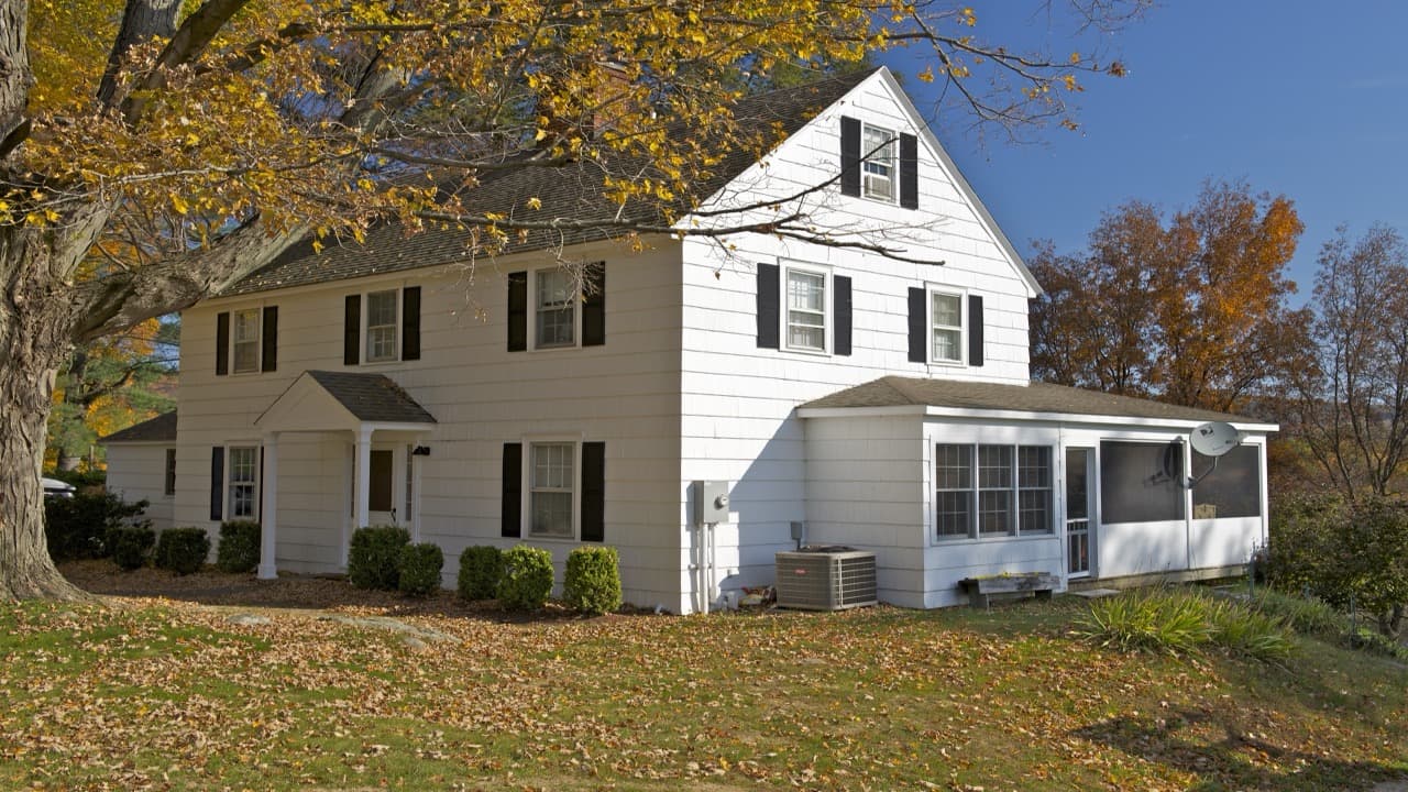 Historic Colonial home with covered porch in Sandwich, MA representing APF Carpentry Corp service area